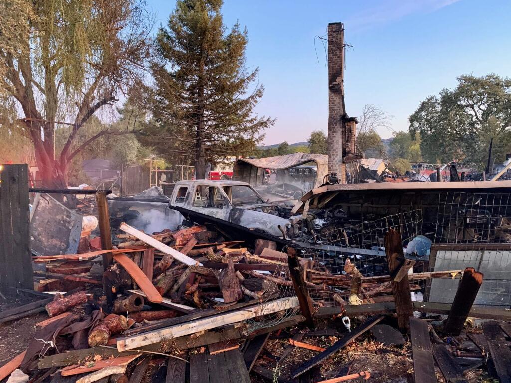 Fire department personnel inspects the smoldering fire on the 600 block of Napa Road on Monday, Oct. 28, 2019. (LORNA SHERIDAN/ SONOMA INDEX-TRIBUNE)