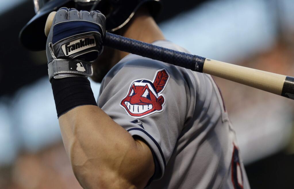 FILE - This June 26, 2015, file photo, shows the Cleveland Indians logo on a jersey during a baseball game against the Baltimore Orioles in Baltimore. Indians are taking the divisive Chief Wahoo logo off their uniforms and caps, starting in 2019. (AP Photo/Patrick Semansky, File)