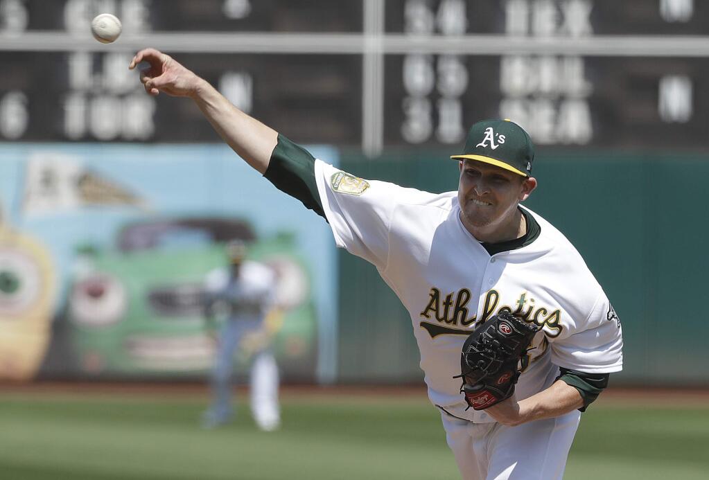 Oakland Athletics pitcher Trevor Cahill throws against the New York Yankees during the first inning in Oakland, Monday, Sept. 3, 2018. (AP Photo/Jeff Chiu)