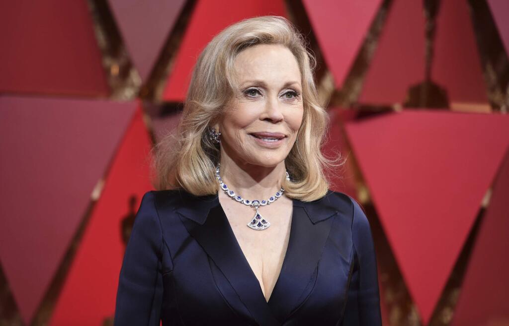 FILE - In this Sunday, Feb. 26, 2017, file photo, Faye Dunaway arrives at the Oscars on at the Dolby Theatre in Los Angeles. Dunaway says she thought co-presenter Warrant Beatty was joking when he paused before showing her the envelope with the Oscar‚Äôs best picture winner. (Photo by Richard Shotwell/Invision/AP, File)
