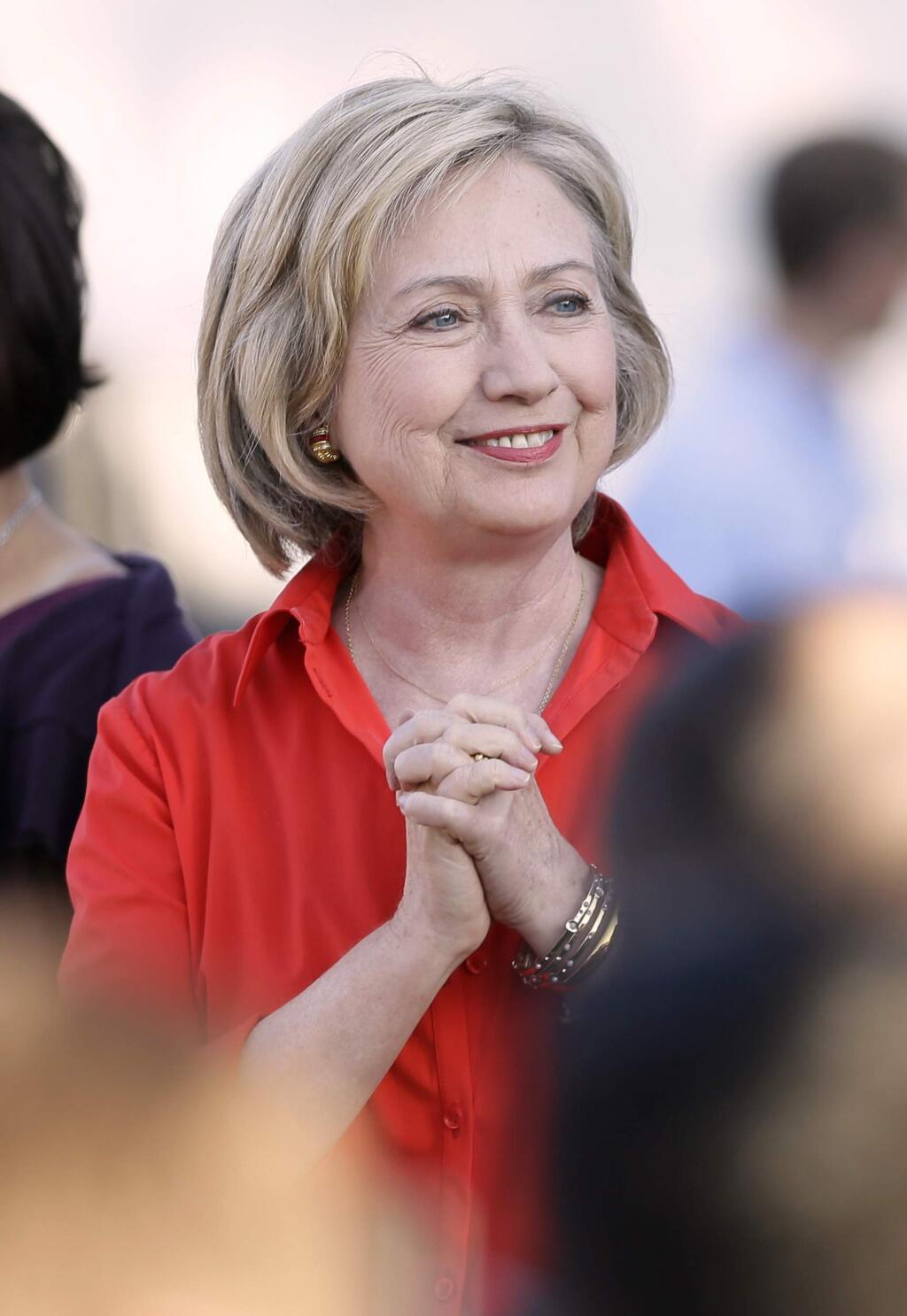 Democratic presidential candidate Hillary Rodham Clinton arrives at a town hall meeting, Tuesday, Nov. 3, 2015, in Coralville, Iowa. (AP Photo/Charlie Neibergall)