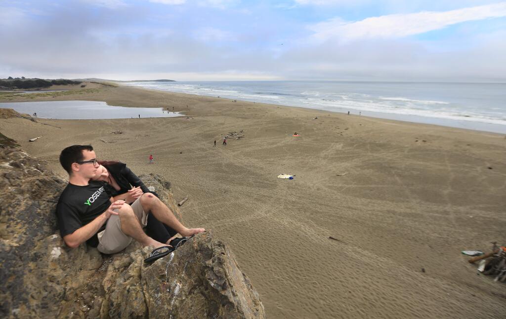 Andrew Trujillo, left of Alaska and Alexis Wiffler of Cotati relax at Salmon Creek State Beach on Wednesday, June 10, 2015. (KENT PORTER/ PD)