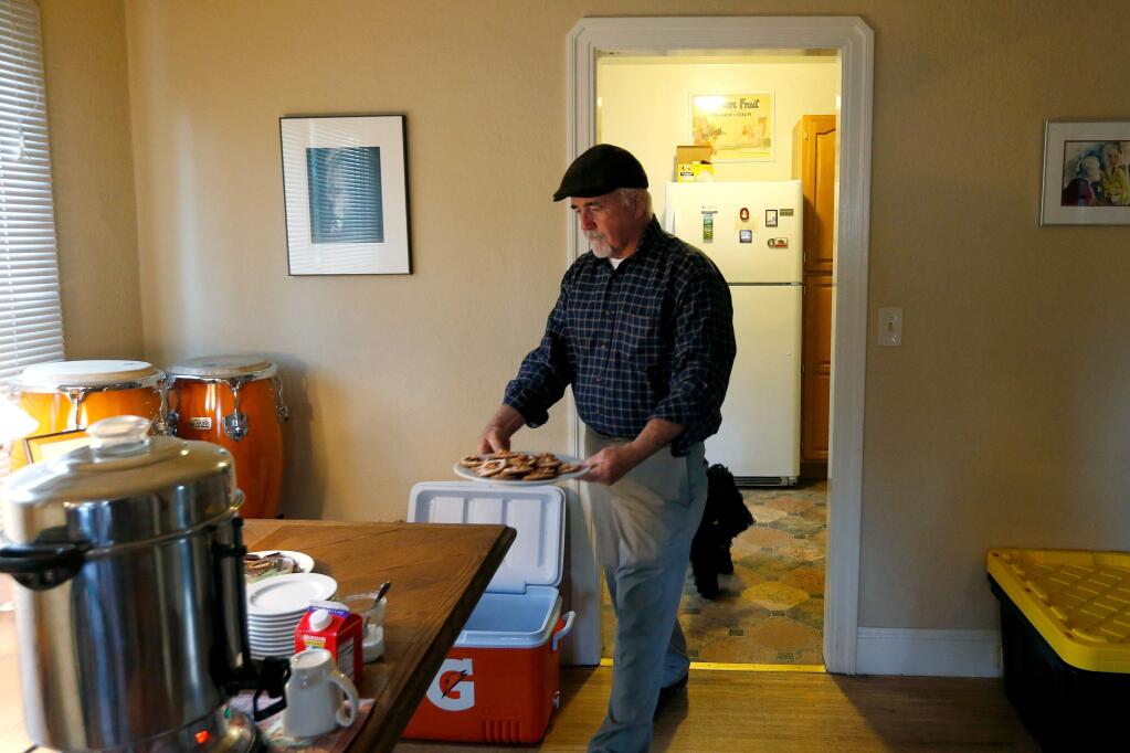 Dennis McGovern prepares food for a meeting where he and other evicted tenants will talk about their evictions with Sonoma County supervisor Efren Carrillo and Ronit Rubinoff, executive director of Legal Aid of Sonoma County, at McGovern's home in Santa Rosa, California on Thursday, April 14, 2016. (Alvin Jornada / The Press Democrat)