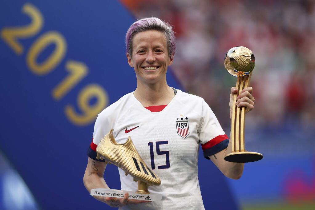 In this Sunday, July 7, 2019 file photo, United States' Megan Rapinoe poses with her individual awards at the end of the Women's World Cup final soccer match between the US and the Netherlands at the Stade de Lyon in Decines, outside Lyon, France. (AP Photo/Francisco Seco, File)