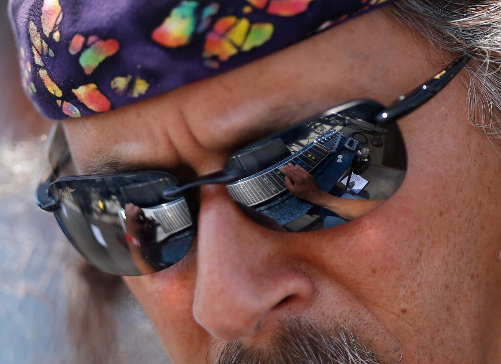 Barry Sless of Moonalice plays the pedal steel guitar, reflected in his sunglasses, during the Petaluma Music Festival, which benefits local school music programs, in Petaluma, California on Saturday, August 6, 2016. (Alvin Jornada / The Press Democrat)