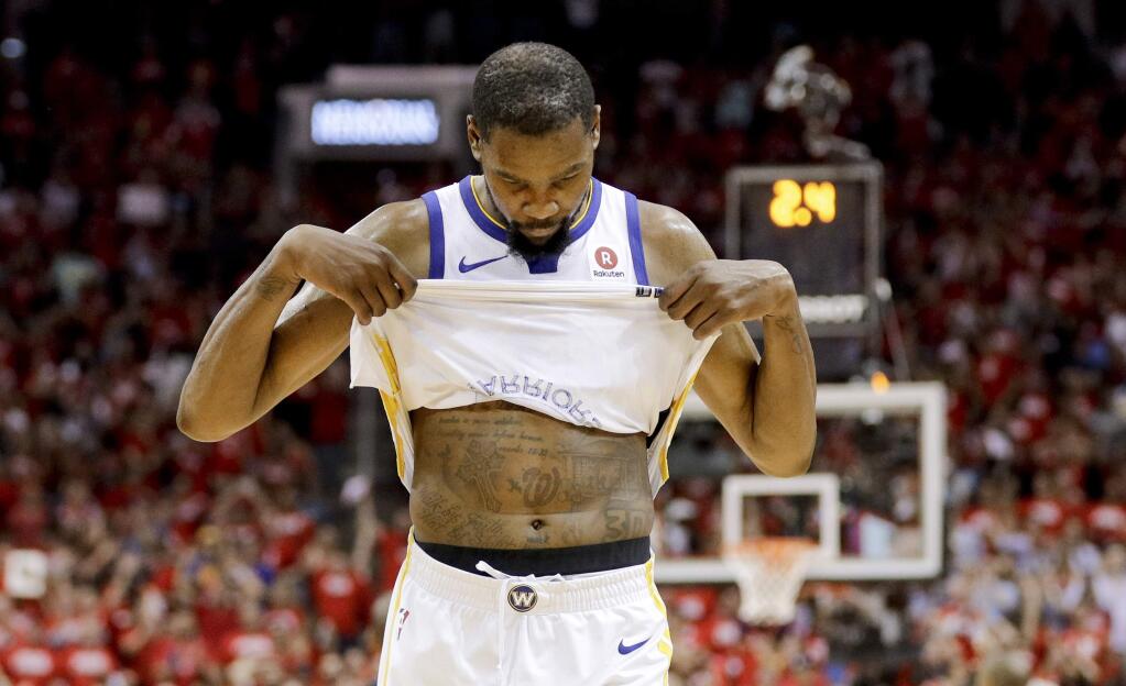 Golden State Warriors forward Kevin Durant reacts in the final seconds of the team's 98-94 loss to the Houston Rockets in Game 5 of the NBA Western Conference final in Houston, Thursday, May 24, 2018. (AP Photo/David J. Phillip)