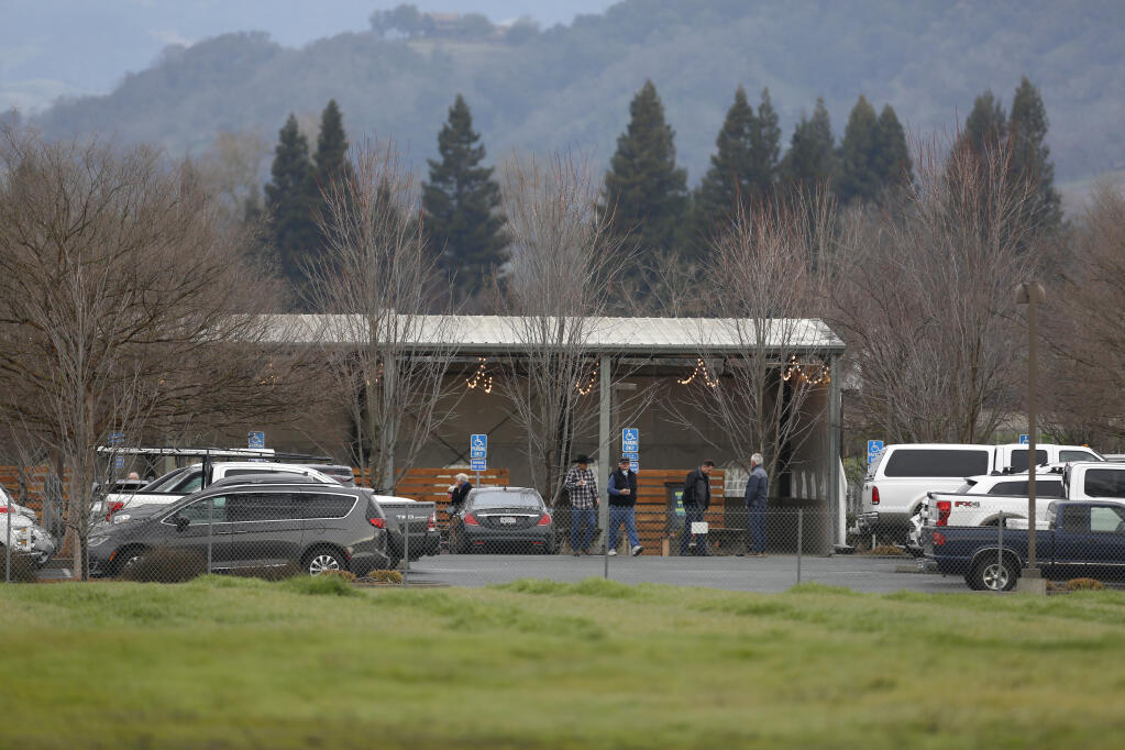 People walk through the parking lot between services at Spring Hills Church in Santa Rosa, California, on Sunday, Jan. 31, 2021. (The Press Democrat)