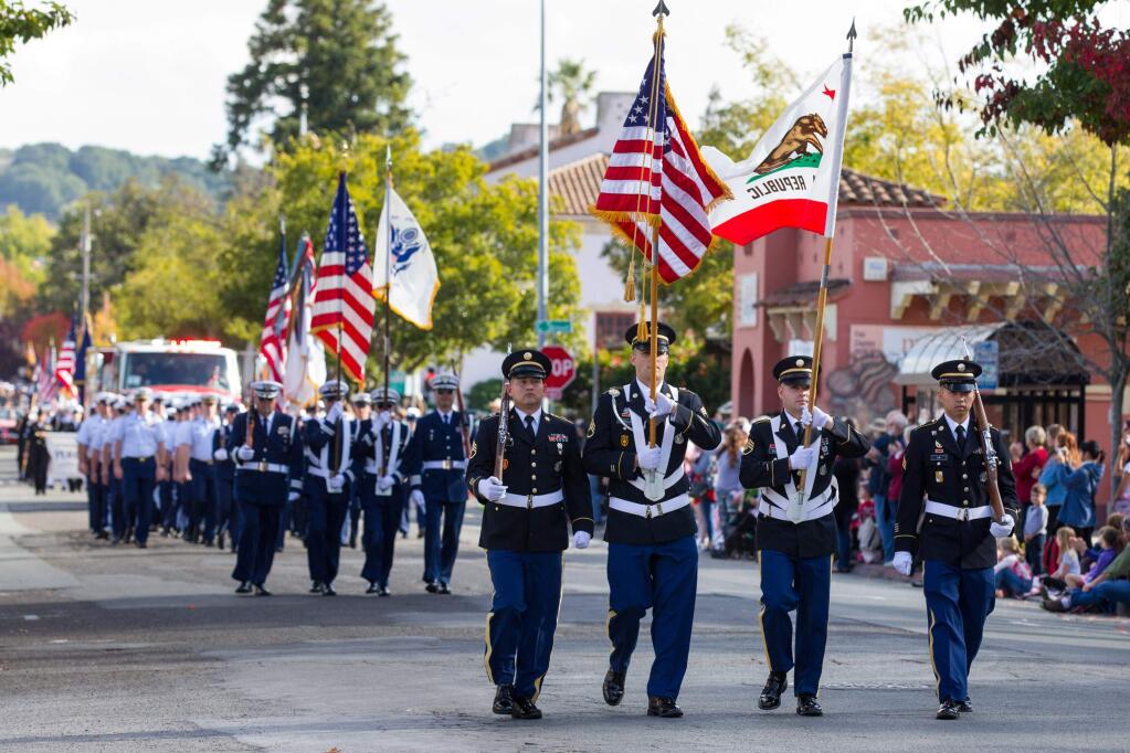 Several U.S. military color guard lead off the 2017 annual Veteran's Day Parade in Petaluma, on Saturday, November 11, 2017. (Photo by Darryl Bush / For The Press Democrat)