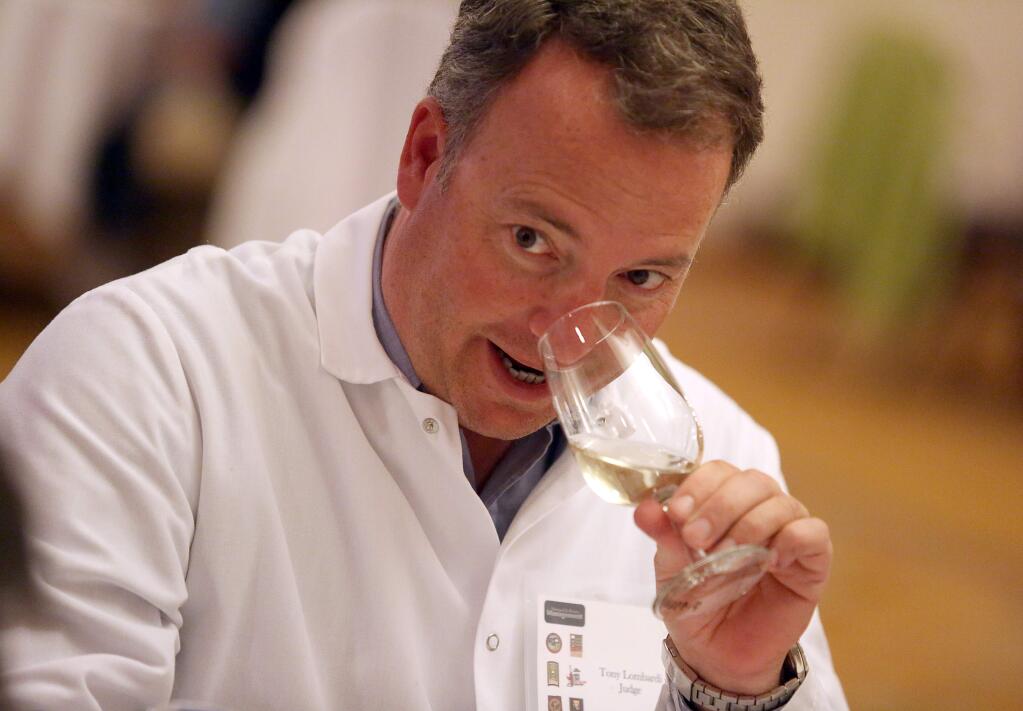 Tony Lombardi judges wines as part of the third annual North Coast Wine Challenge held at the Hilton Sonoma Wine Country Hotel, Tuesday, April 14, 2015. (CRISTA JEREMIASON / The Press Democrat)