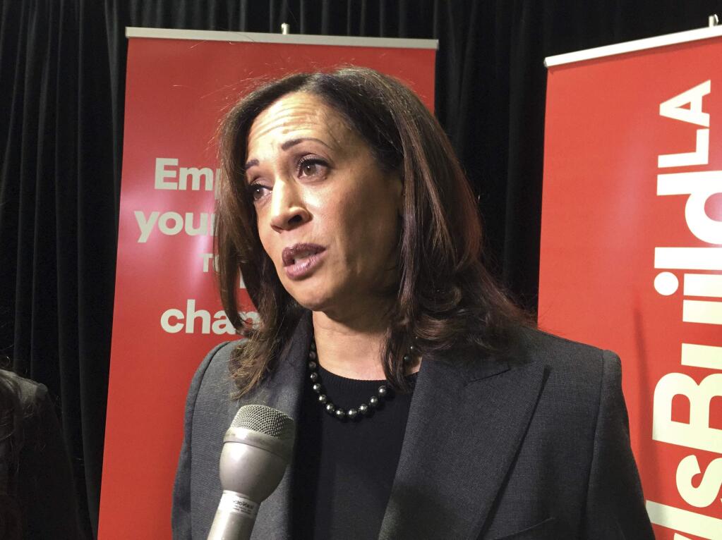 FILE - In this Dec. 15, 2017, file photo, Sen. Kamala Harris, D-Calif, speaks to reporters in Los Angeles. Sen. Cory Booker, D-N.J., and Harris have been appointed to serve on the Senate Judiciary Committee, becoming just the second and third African-Americans to serve on the committee in its 200-plus-year history. (AP Photo/Amanda Lee Myers, File)