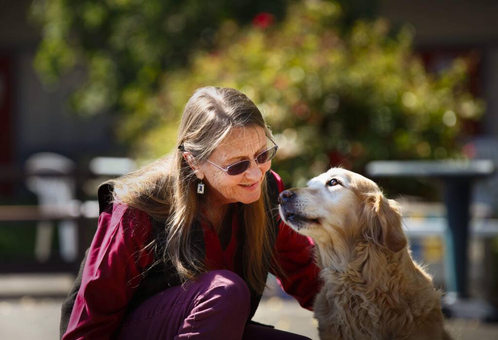 Bonita (Bonnie) Bergin, who founded Bergin University of Canine Studies in Sonoma County, hangs out with Judy the dog on July 10, 2017. (CRISSY PASCUAL/ARGUS-COURIER STAFF)