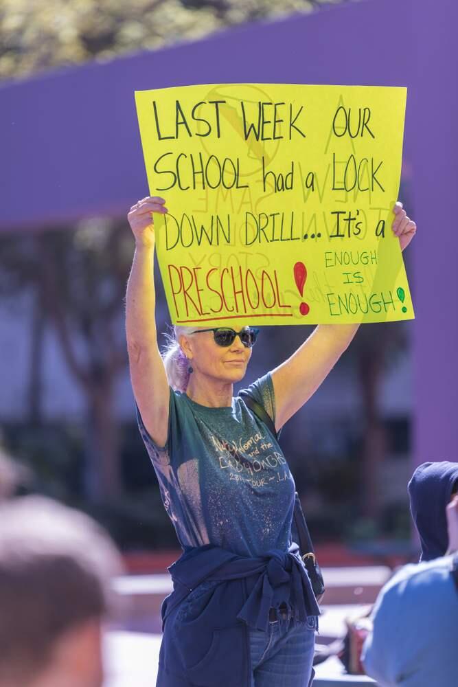 A Los Angeles-area mom's sign notes the lock-down drill her child's preschool recently held.Shutterstock.