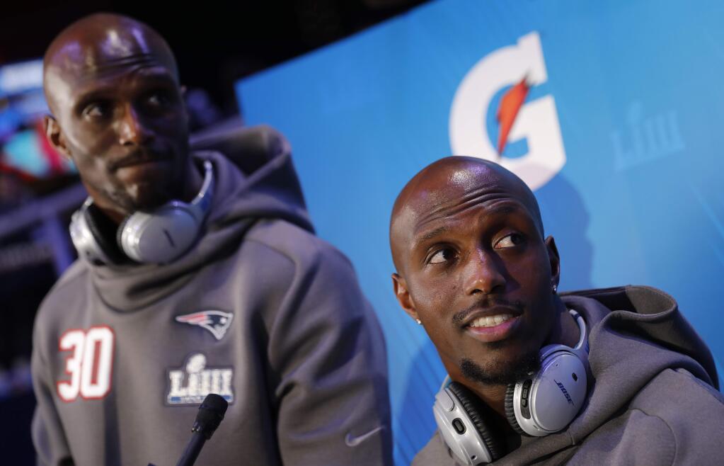 New England Patriots' Jason McCourty and Devin McCourty answer questions during Opening Night for the NFL Super Bowl 53 football game Monday, Jan. 28, 2019, in Atlanta. (AP Photo/David Goldman)