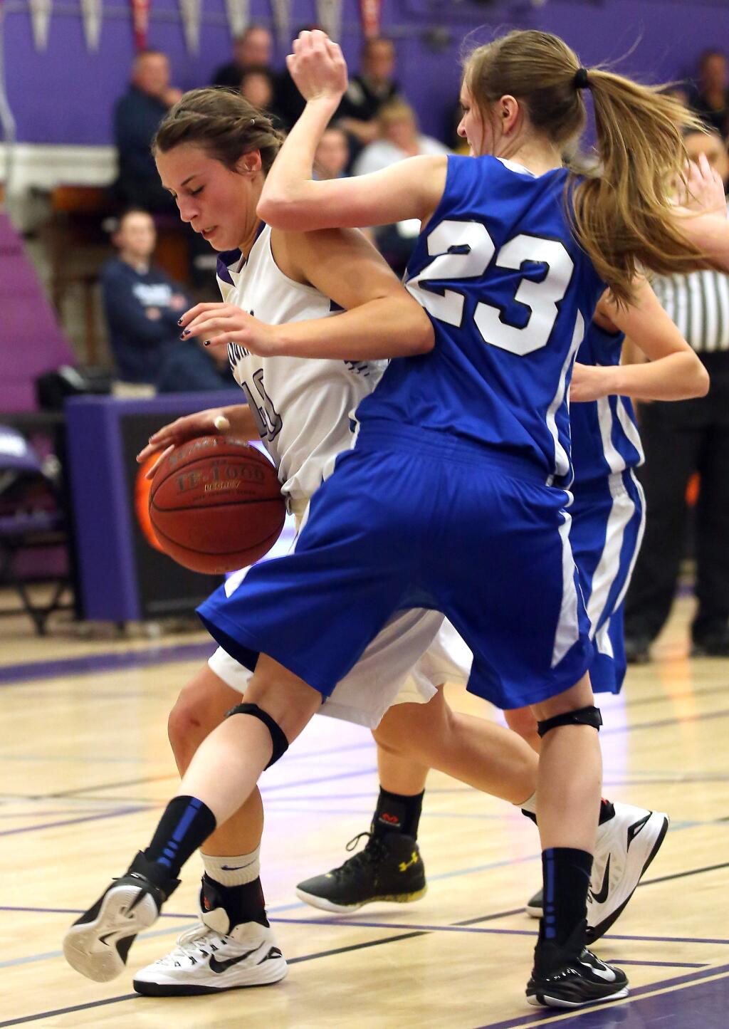 Analy's Taylor Lehmann stops Petaluma's Joelle Krist from going to the basket during the game held at Petaluma High School, Thursday, January 15, 2015. (Crista Jeremiason / The Press Democrat)