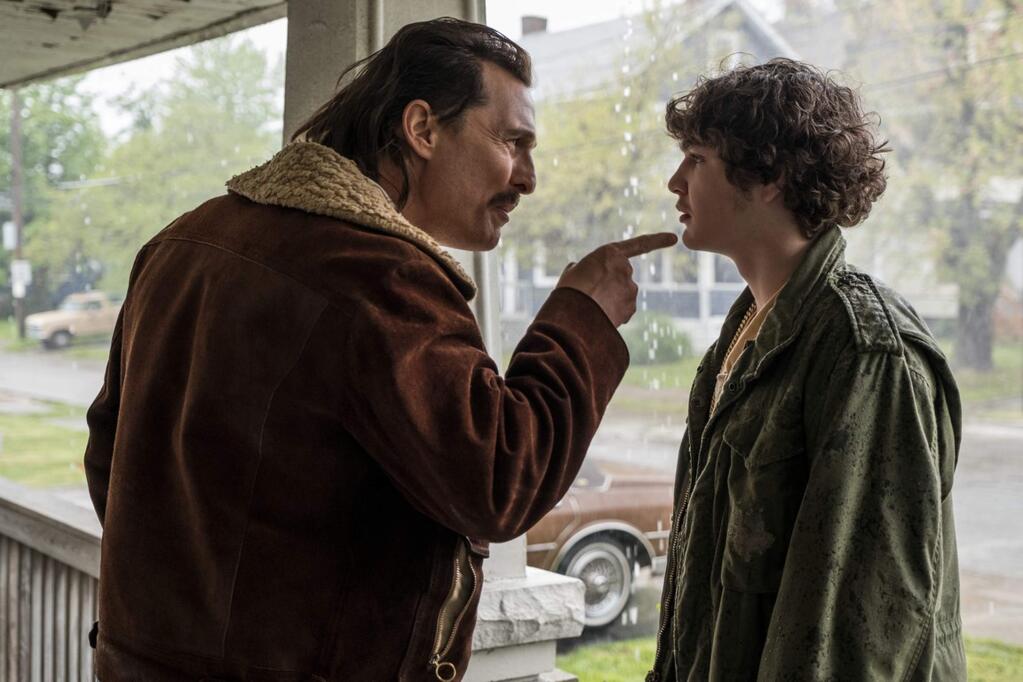 Matthew McConaughey, left, as Richard Wershe, Sr., and Richie Merritt as Richard 'White Boy Rick' Wershe, Jr., in 'White Boy Rick,' based on a true story set in Detroit in the 1980s of a blue-collar father and his teenage son who became an undercover police informant and later a drug dealer, before he was abandoned by his handlers and sentenced to life in prison. (Columbia Pictures)