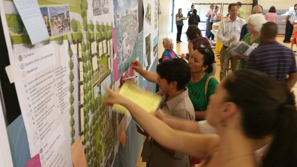 Santa Rosa residents offered feedback on three rival proposals to build a mixed-use development in the Roseland district at a public forum on Thursday, June 25, 2015. (MARTIN ESPINOZA / Press Democrat)