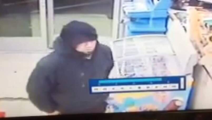 A robbery suspect is seen in Rite Aid surveillance footage. (Ukiah Police)