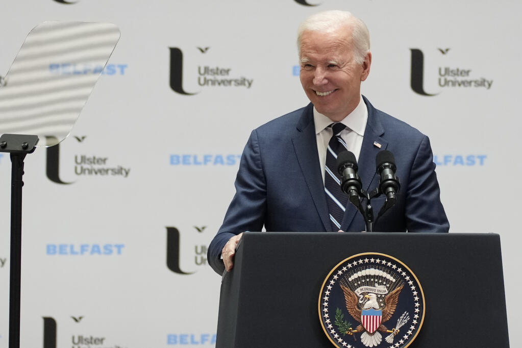 President Joe Biden smiles as he makes a speech about Northern Ireland's vast economic potential at the Ulster University's new campus in Belfast, Northern Ireland, Wednesday, April 12, 2023. President Biden is in Northern Ireland on Wednesday to participate in marking the 25th anniversary of the Good Friday Agreement, which brought peace to this part of the United Kingdom, as a new political crisis tests the strength of that peace.(AP Photo/Christophe Ena)