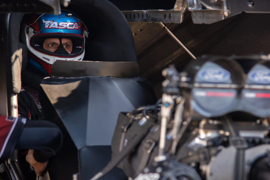 Driver Bob Tasca III sits in the cockpit of his Funny Car while waiting to race in the second qualifying round at the NHRA Sonoma Nationals at Sonoma Raceway on Saturday, July 24, 2021. (Alvin A.H. Jornada / For The Press Democrat)