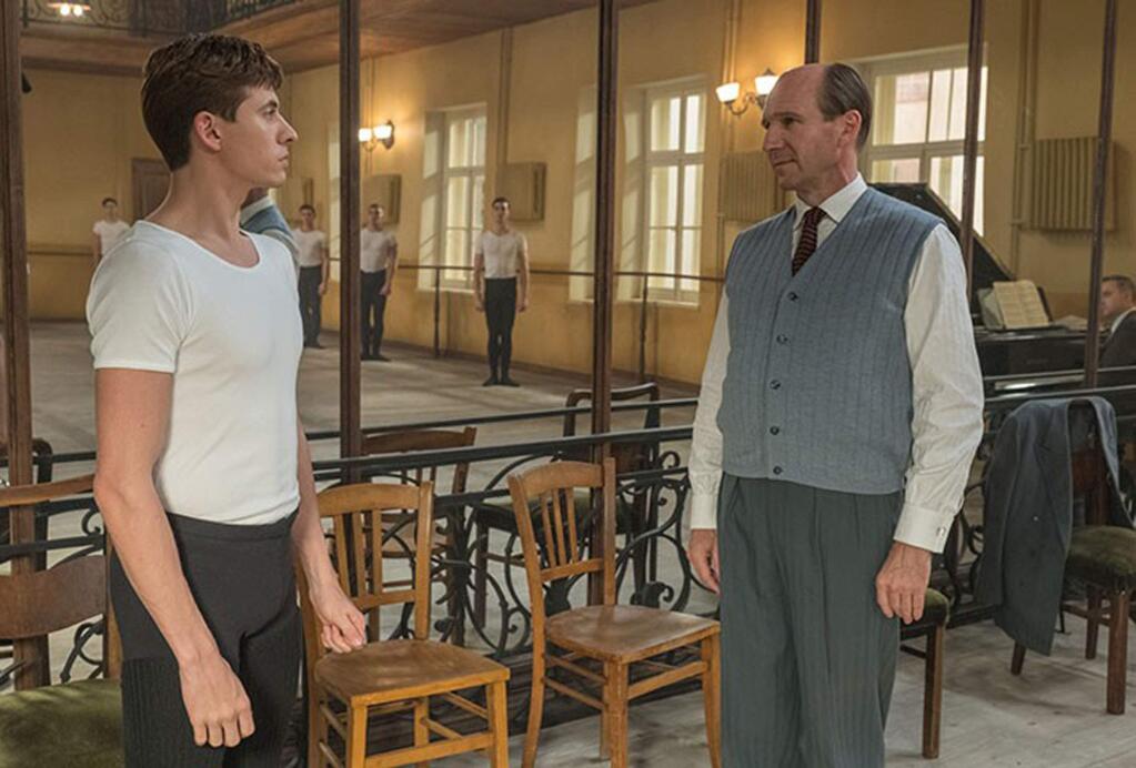 Oleg Ivenko, left, as Rudolf Nureyev, the iconic dancer who defected from the Soviet Union to the West in 1961, and Rallph Fiennes as Alexander Pushkin, the Russian choreographer Alexander Pushkin, in 'The White Crow.' (Sony Pictures Classics)