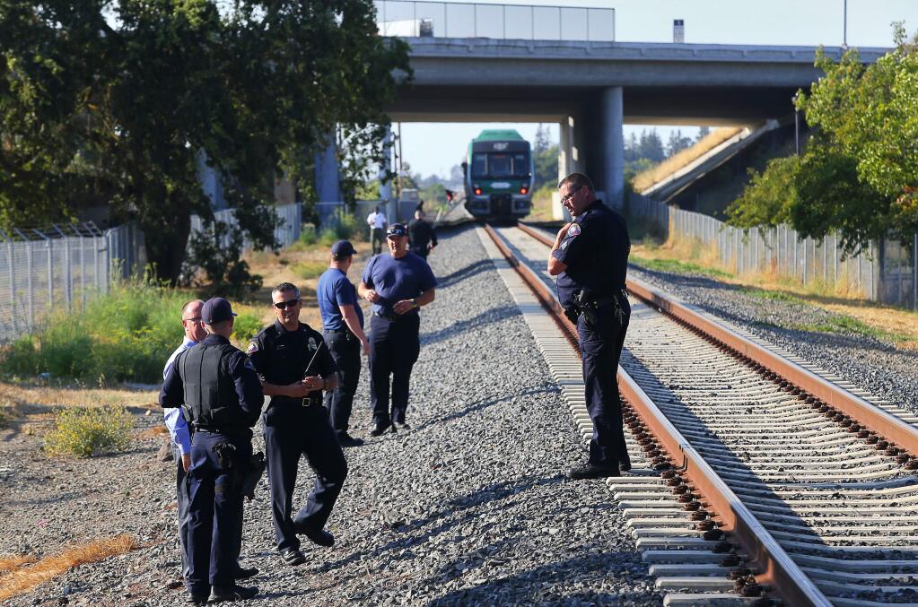 Rohnert Park Police investigate the scene of a fatal accident involving a SMART train and a pedestrian at Golf Course Drive in Rohnert Park on Thursday, Aug.30, 2018. (CHRISTOPHER CHUNG/ PD)