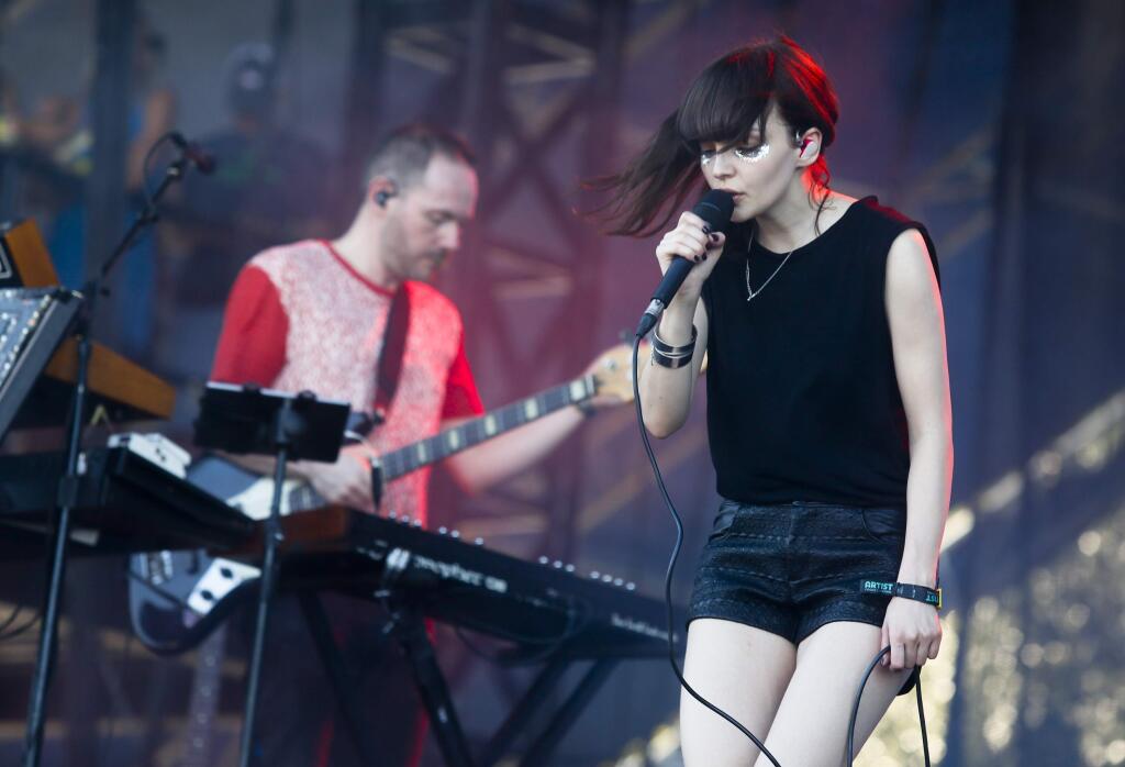 Chvrches' Lauren Mayberry, right, and Iain Cook perform on the first day of the Austin City Limits Music Festival on Friday, Oct. 3, 2014, in Austin, Texas. (Photo by Jack Plunkett/Invision/AP)