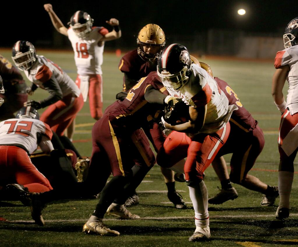Rancho Cotate's Rasheed Rankin goes over for the winning touchdown against Las Lomas, Friday, Nov. 29, 2019 to take the NCS championship. In the background is quarterback Jared Stocker. (Kent Porter / The Press Democrat) 2019