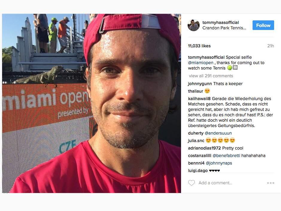 Tommy Haas pauses for a selfie with a wayward iguana that interrupted the tennis match at the Miami Open, Wednesday, March 22, 2017. (INSTAGRAM)