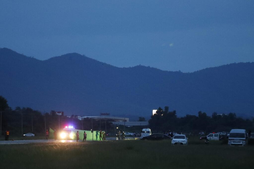 An ambulance waiting for arrival of helicopter of the rescued boys from the flooded cave, in the Mae Sai district of Chiang Rai province, northern Thailand, Monday, July 9, 2018. (AP Photo/Vincent Thian)