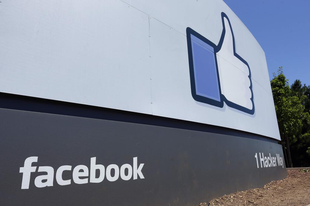 FILE - This July 16, 2013, file photo shows a sign at Facebook headquarters in Menlo Park, Calif. (AP Photo/Ben Margot, File)
