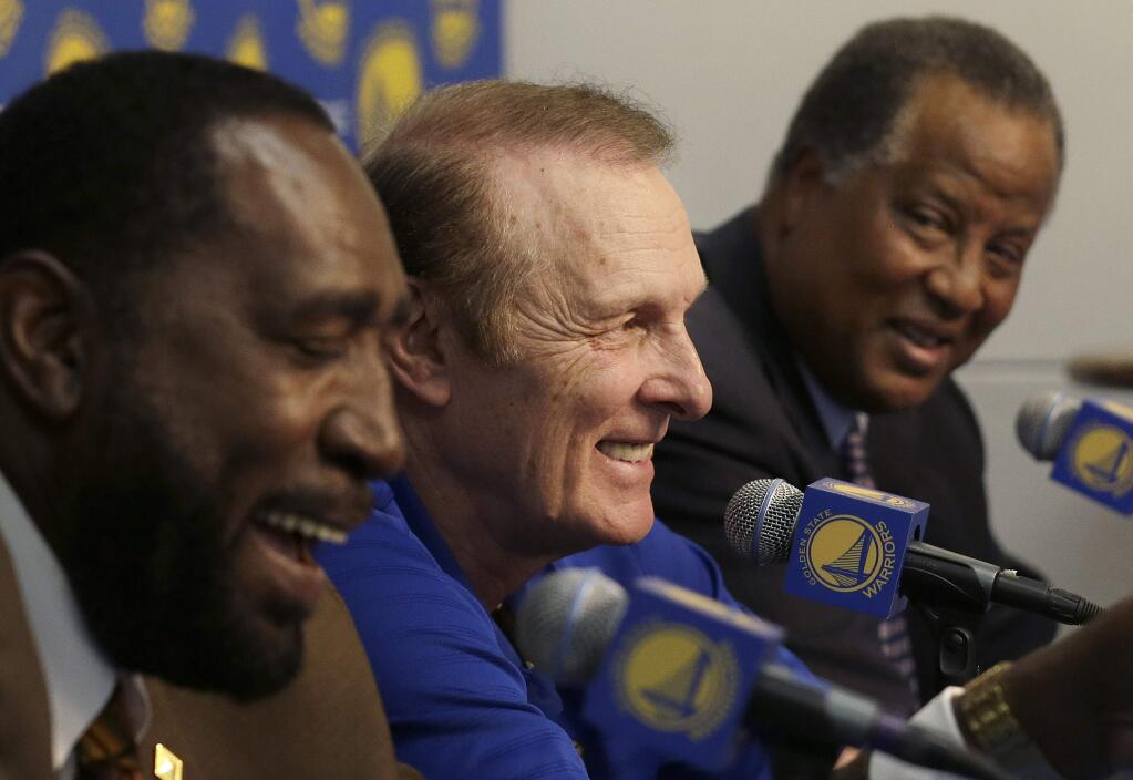 Former 1975 Golden State Warriors players Clifford Ray, from left, Rick Barry and Jamaal Wilkes smile during a news conference about the 40th anniversary of championship before an NBA basketball game between the Warriors and the Washington Wizards in Oakland, Calif., Monday, March 23, 2015. (AP Photo/Jeff Chiu)