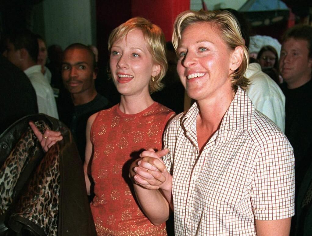FILE - In this June 19, 1997 file photo, actress-comedian Ellen DeGeneres, right, and actress Anne Heche arrive at the world premiere of the film 'Face/Off,' in the Hollywood section of Los Angeles. It was 20 years ago that Ellen DeGeneres made history as the first prime-time lead on network TV to come out of the closet. The episode of 'Ellen' was watched by a staggering 44 million viewers. It won an Emmy for writing, a Peabody as a landmark in broadcasting and numerous other accolades(AP Photo/Chris Pizzello, File)