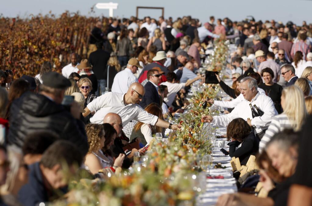People attend the Grateful Table dinner hosted by chef Tyler Florence in Sonoma, on Tuesday, November 21, 2017. (BETH SCHLANKER/ The Press Democrat)