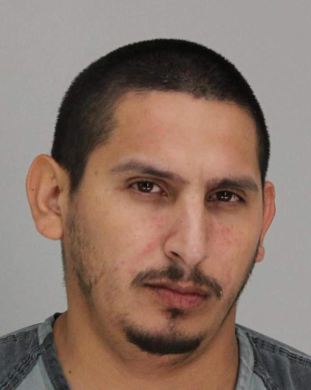 This undated photo provided by the Dallas County Sheriff's Department shows Armando Juarez. Juarez is accused of shooting and critically wounding multiple Dallas police officers and hurting an employee at a Home Depot store as he led law enforcement on a high-speed car chase before he was captured in a late-night arrest Tuesday, April 24, 2018. Police arrested Juarez on charges of aggravated assault on a public servant and felony theft. (Dallas County Sheriff's Department via AP)