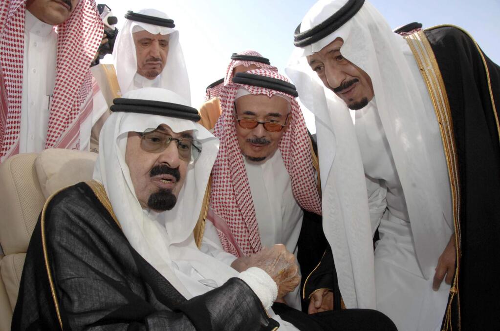 King Abdullah of Saudi Arabia, seated, speaks with Prince Salman, right, his half-brother. Salman was announced as the successor to Abdullah, who died on Thursday. (SAUDI PRESS AGENCY)