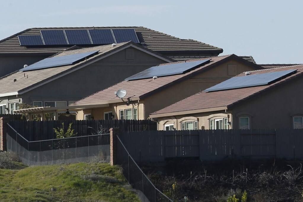 In this photo taken Wednesday Feb. 12, 2020, are solar panels on rooftops of a housing development in Folsom. (RICH PEDRONCELLI/ASSOCIATED PRESS)