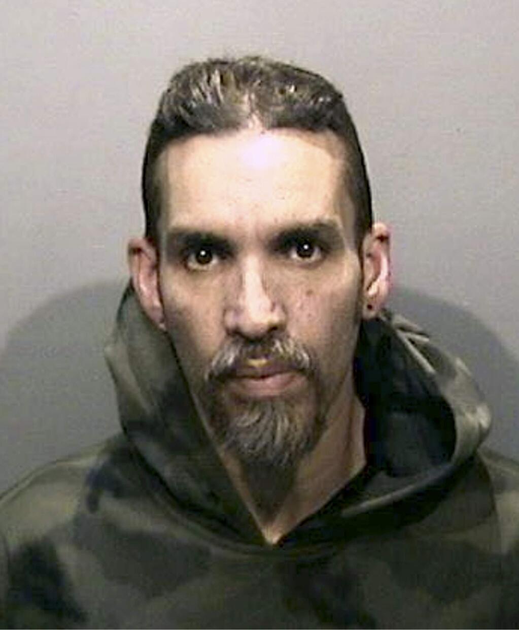 FILE - This Monday, June 5, 2017, file photo released by the Alameda County Sheriff's Office shows Derick Almena at Santa Rita Jail in Alameda County, Calif. Almena and Max Harris (not pictured) have pleaded not guilty to involuntary manslaughter charges in connection with a fire in an illegally converted Northern California warehouse that killed 36 people. Both entered pleas Tuesday, Sept. 26, 2017 to 36 counts of involuntary manslaughter each. Prosecutors say the two men turned the warehouse into a deathtrap when they illegally converted it into a housing and entertainment venue. (Alameda County Sheriff's Office via AP, File)