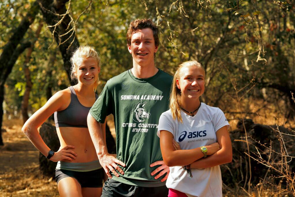 Sonoma Academy cross country runners, from left, Rylee Bowen, Caleb Richards, and McKenna Sell pose for a portrait before a Sonoma Academy cross country team workout at Howarth Park in Santa Rosa, California, on August 26, 2015. (Alvin Jornada / The Press Democrat)