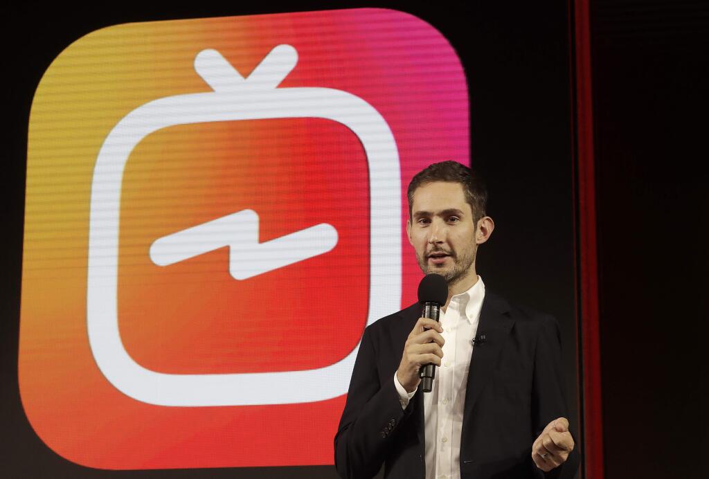 FILE - In this Tuesday, June 19, 2018, file photo, Kevin Systrom, CEO and co-founder of Instagram, prepares for an announcement about IGTV in San Francisco. In a statement late Monday, Sept. 24, 2018, Systrom said in a statement that he and Mike Krieger, Instagram's chief technical officer, plan to leave the company in the next few weeks and take time off “to explore our curiosity and creativity again.” (AP Photo/Jeff Chiu, File)