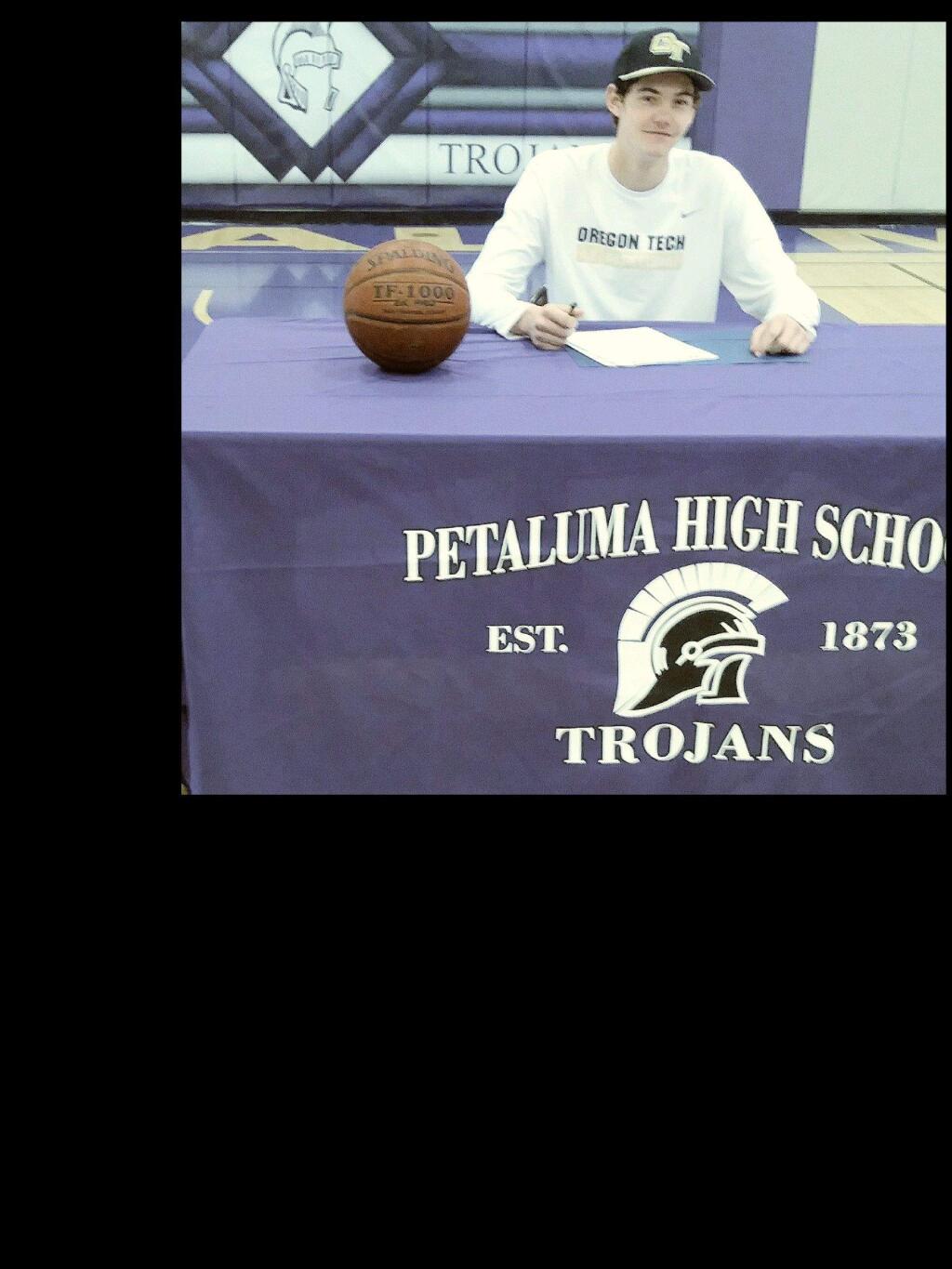 JOHN JACKSON/ARGUS-COURIER STAFFPetaluma High basketball standout Joey Potts signs a Letter of Intent to attendi college at Oregon Institute of Technology.