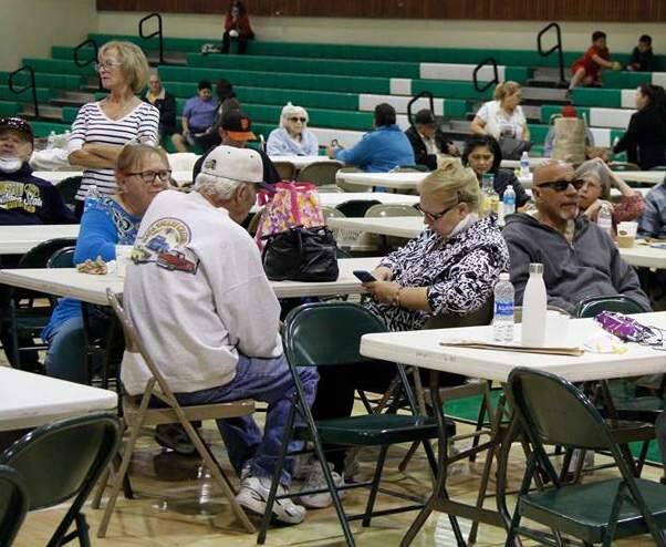 Sonoma residents wait out the Oct. 9 fire crisis in the gymnasium at Sonoma Valley High School. (Bill Hoban/Index-Tribune)