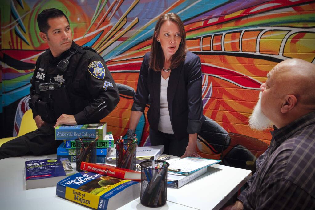 Petaluma, CA, USA. Thursday, January 18, 2018._ Deborah Dalton, Executive Director at Mentor Me works closely with police officer, Zilverio (Zeus) Rivera in a new restorative justice program for teens. Dolan Beaird (far right), the advocacy team caseworker also assists in the program. (CRISSY PASCUAL/ARGUS-COURIER STAFF)