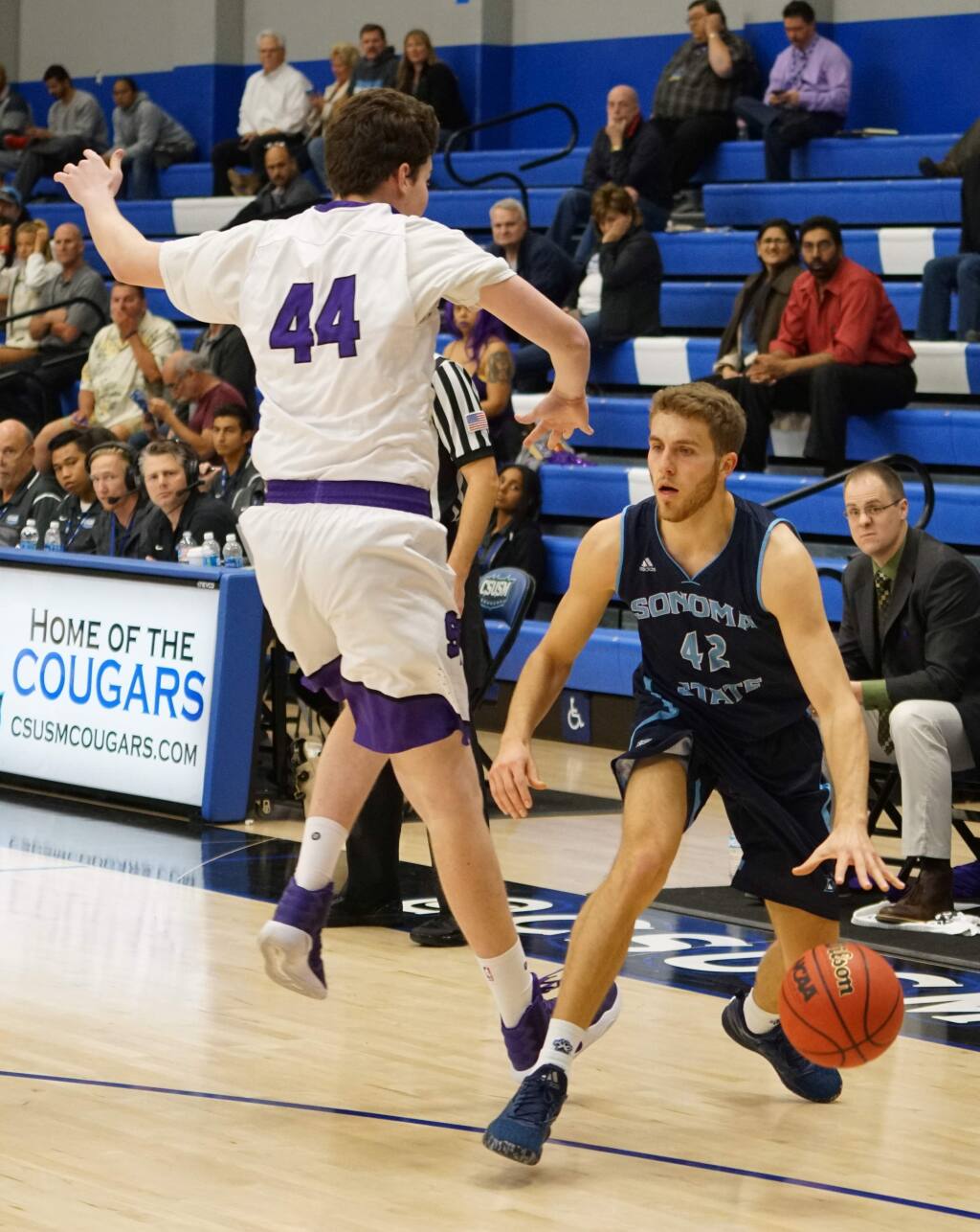 Sonoma State guard Jackson Gion, right, gets San Francisco State defender Ryne Williams off his feet in the CCAA quarterfinal tournament game on Friday. (Sonoma State Athletic Department)