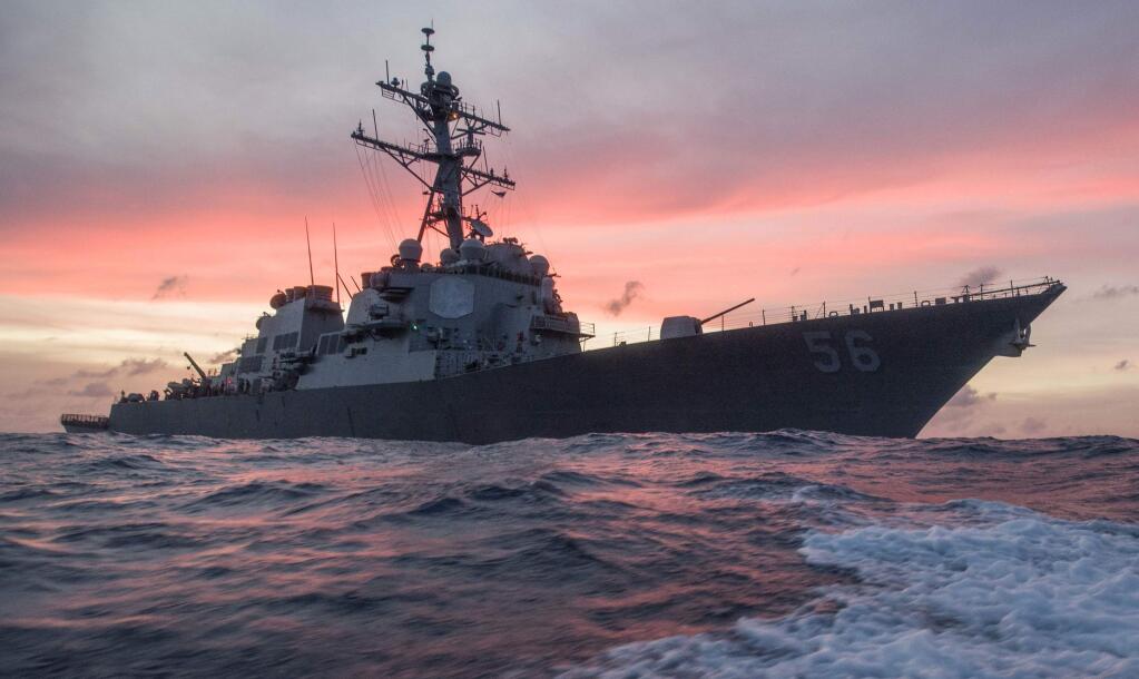 In this Jan. 22, 2017, photo provided by U.S. Navy, the USS John S. McCain conducts a patrol in the South China Sea while supporting security efforts in the region. The guided-missile destroyer collided with a merchant ship on Monday, Aug. 21, in waters east of Singapore and the Straits of Malacca. (James Vazquez/U.S. Navy via AP)