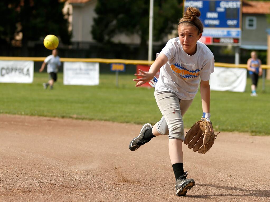 Cloverdale second baseman Hailey Donahoo makes a backhand toss during infield drills at varsity softball practice at Daly Field in Cloverdale, California, on Friday, April 8, 2016. (Alvin Jornada / The Press Democrat)