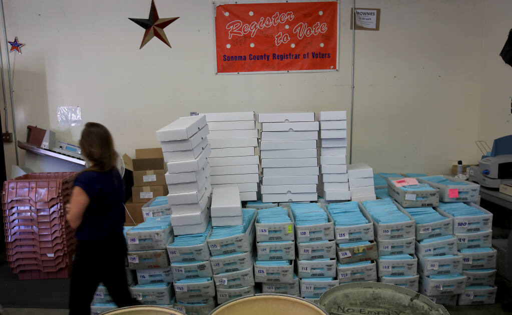 Stacks of mail ballots are stored before being sorted at the Sonoma County Registrar of Voters, Wednesday, Nov. 4, 2020 in Santa Rosa. (Kent Porter / The Press Democrat) 2020