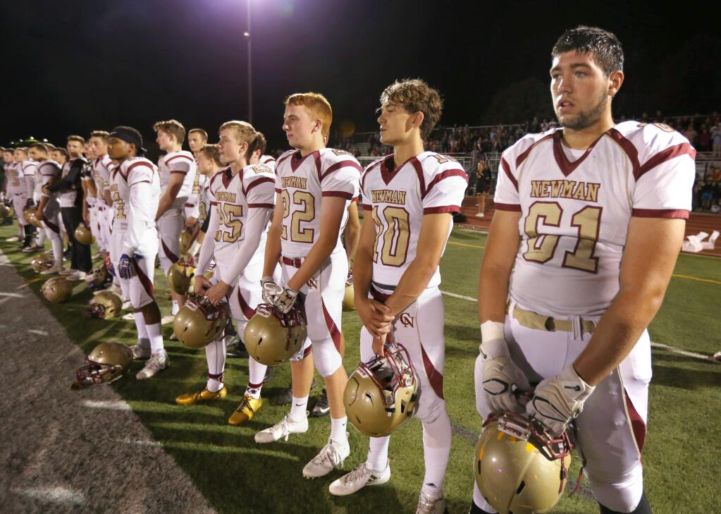 Cardinal Newman players stand on the sideline before a game against Rancho Cotate at Rancho Cotate High School in Rohnert Park, on Monday, Oct. 23, 2017. (Photo by Darryl Bush / For The Press Democrat)