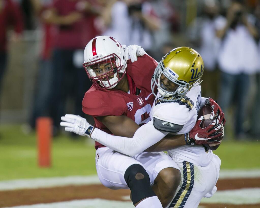 Stanford Cardinal wide receiver Francis Owusu (6) makes a touchdown catch around UCLA Bruins defensive back Jaleel Wadood (2) during a 2015 game. Stanford defeated UCLA 56-35. (Damon Tarver/Cal Sport Media)