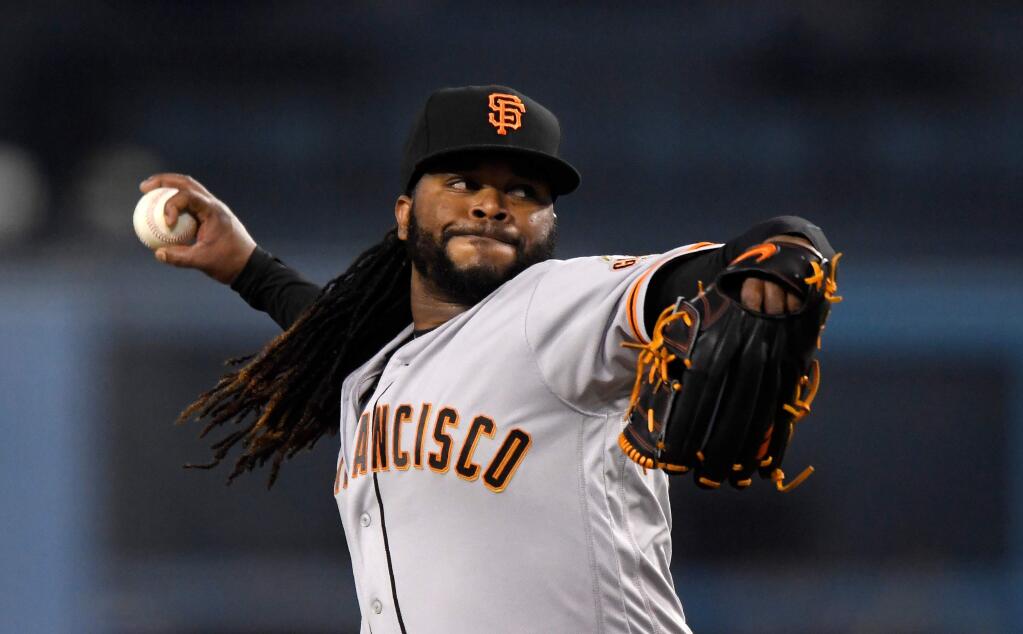 San Francisco Giants starting pitcher Johnny Cueto throws to the plate during the first inning against the Los Angeles Dodgers, Friday, March 30, 2018, in Los Angeles. (AP Photo/Mark J. Terrill)