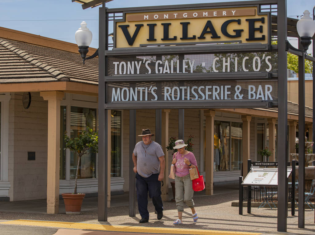 Shoppers make their way through Montgomery Village May 19, 2022. (Chad Surmick / The Press Democrat)